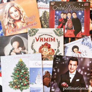 A collage of famous Christmas song album covers, including Mariah Carey's 
